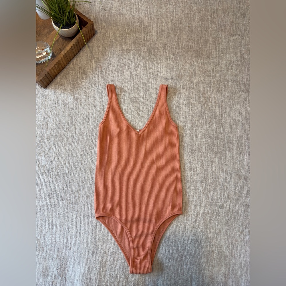 Aura orange/peach one size body suit
